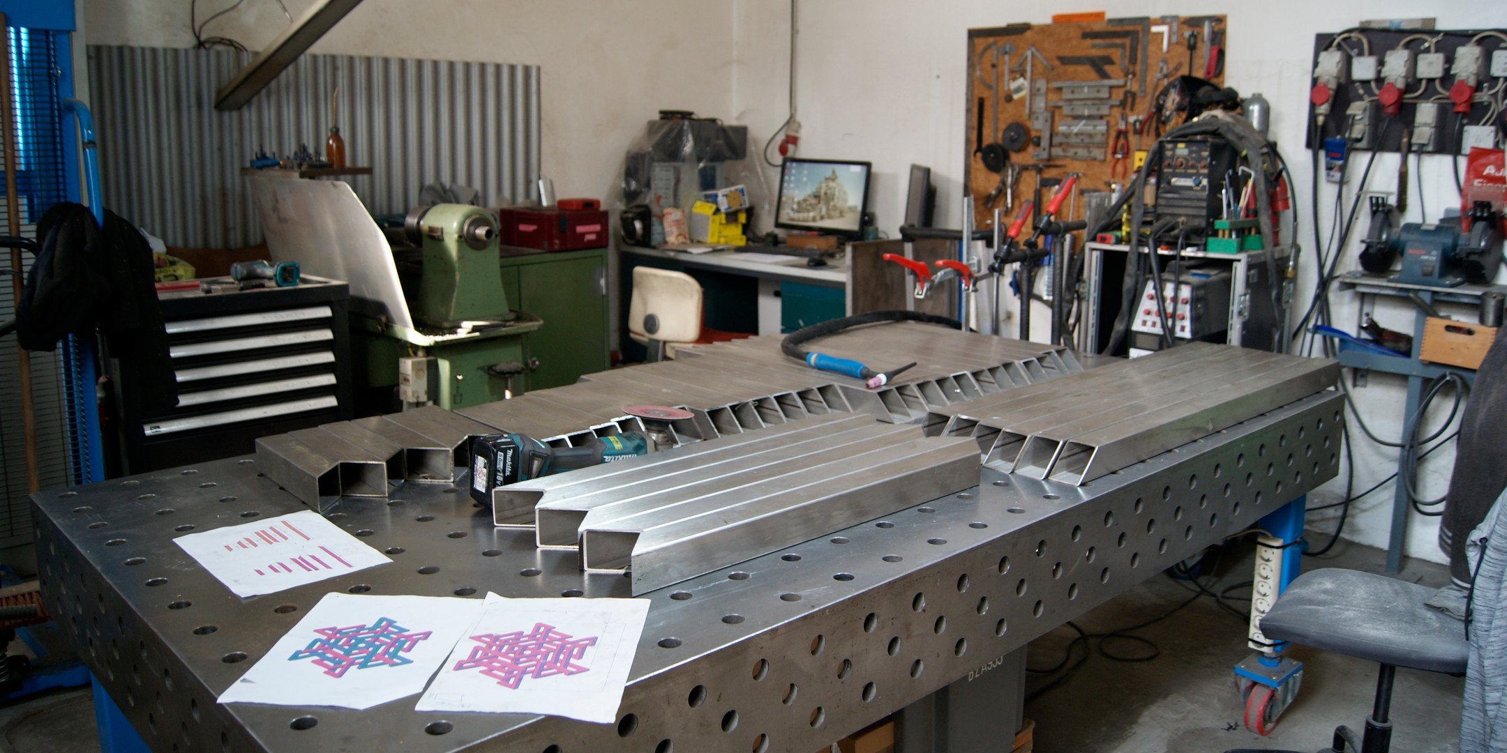 sundowner — stainless-steel segments cut in the workshop, with knot diagrams